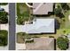 Aerial view of the home showcasing the roof, driveway, and backyard at 5952 Brittania Blvd, Tavares, FL 32778