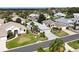 An aerial view of well-maintained single-Gathering homes with lush landscaping at 5952 Brittania Blvd, Tavares, FL 32778