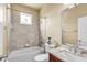 Bathroom featuring a shower-tub combination with tile surround, neutral walls, and granite vanity at 6240 Tremayne Dr, Mount Dora, FL 32757