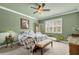 Bedroom featuring carpet, shutters, decorative lamps, and a unique ceiling fan at 6240 Tremayne Dr, Mount Dora, FL 32757