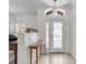 Bright entryway featuring tiled floors, transom window, and chandelier at 6240 Tremayne Dr, Mount Dora, FL 32757