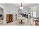 Bright foyer with tile flooring, a decorative table with flowers, and views of a piano room beyond at 6240 Tremayne Dr, Mount Dora, FL 32757