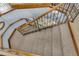 A view looking down a carpeted staircase with decorative wooden handrails at 6240 Tremayne Dr, Mount Dora, FL 32757