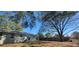 Large backyard with mature trees and a full privacy fence at 6720 Se 107Th St, Belleview, FL 34420