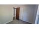 Bedroom featuring a closet, carpet, and natural lighting at 6720 Se 107Th St, Belleview, FL 34420