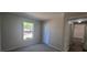 Bedroom featuring carpet, natural light, and closet at 6720 Se 107Th St, Belleview, FL 34420