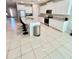 Modern kitchen with white cabinetry, stainless steel appliances, and granite countertops at 6853 Se 3Rd Loop, Ocala, FL 34472