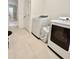 Convenient laundry area equipped with modern washer and dryer units, and extra space at 6853 Se 3Rd Loop, Ocala, FL 34472