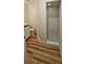 Bathroom featuring a walk-in shower with white tile and neutral paint at 709 S Highland St, Mount Dora, FL 32757