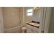 Full bathroom featuring a vanity sink, mirror, faucet, toilet, and bath tub at 709 S Highland St, Mount Dora, FL 32757