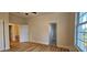 Another bedroom angle shows a view from the window and a doorway to the ensuite bath at 709 S Highland St, Mount Dora, FL 32757