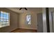 Bedroom featuring hardwood floors, ceiling fan, and window views at 709 S Highland St, Mount Dora, FL 32757