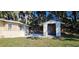 View of home, showing yard and an outbuilding at 709 S Highland St, Mount Dora, FL 32757