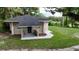 Charming home exterior featuring manicured lawn and inviting entrance at 709 S Highland St, Mount Dora, FL 32757