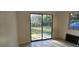 Room featuring glass sliding doors leading to the backyard at 709 S Highland St, Mount Dora, FL 32757