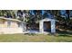 Exterior shot of storage shed near the home featuring new white paint and ample storage space at 709 S Highland St, Mount Dora, FL 32757