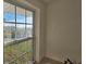 A large window with a view of green grass and trees outside at 709 S Highland St, Mount Dora, FL 32757