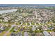 Wide angle aerial showcasing single Gathering homes surrounded by green spaces and lush landscaping at 853 Abaco Path, The Villages, FL 32163