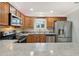 Kitchen counter and stainless steel appliances at 853 Abaco Path, The Villages, FL 32163