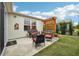 Relaxing patio with comfortable seating, a pergola, and well-maintained landscaping at 853 Abaco Path, The Villages, FL 32163