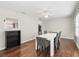 Open dining room with modern lighting and wood floor at 893 Halstead Ter, The Villages, FL 32162