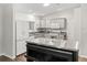 Bright kitchen with granite counters and stainless steel island at 893 Halstead Ter, The Villages, FL 32162