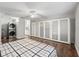 Bright main bedroom with a wall of closets and wood flooring at 893 Halstead Ter, The Villages, FL 32162