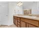 Bathroom vanity with double sinks and modern faucets at 9750 Pepper Tree Pl, Wildwood, FL 34785