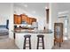 Kitchen featuring stainless steel appliances, dark countertops, and wood cabinets at 9750 Pepper Tree Pl, Wildwood, FL 34785