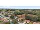 Aerial view showing the home's position within a leafy residential neighborhood with a golf course at 9894 Se 138Th Loop, Summerfield, FL 34491