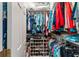 Walk-in closet has plenty of storage space and shelves for organization at 9894 Se 138Th Loop, Summerfield, FL 34491