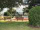 Community memorial area featuring benches, landscaping, and flag display for contemplation and remembrance at 9894 Se 138Th Loop, Summerfield, FL 34491