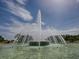 Close-up of a beautiful water fountain under a sunny sky with scattered clouds at 9894 Se 138Th Loop, Summerfield, FL 34491