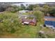 Aerial view of home highlighting its brick exterior, large yard, and neighborhood at 9906 County Road 114A, Wildwood, FL 34785