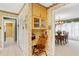 Charming desk nook featuring natural light, cabinets, and a view into dining area at 9906 County Road 114A, Wildwood, FL 34785