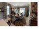 Dining room features modern light fixture, table set for six, with beautiful decor at 10267 Julia Isles Ave, Oxford, FL 34484