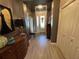 Formal entryway features wainscoting, decorative light fixture and tile floors at 10267 Julia Isles Ave, Oxford, FL 34484