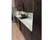 Close up view of the kitchen with stainless steel appliances, modern backsplash, and white countertops at 10267 Julia Isles Ave, Oxford, FL 34484