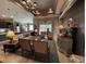 Open floor plan living room and kitchen area features tile floors and lots of light at 10267 Julia Isles Ave, Oxford, FL 34484