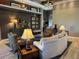 Spacious living room features plush seating, neutral decor, and custom built-ins at 10267 Julia Isles Ave, Oxford, FL 34484