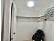 This walk-in closet has ample shelving and storage, perfect for organizing clothes and personal items at 104 Chestnut St, Leesburg, FL 34748