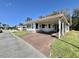 Charming single-story home with a covered carport and well-maintained landscaping at 104 Chestnut St, Leesburg, FL 34748