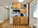Kitchen area featuring custom cabinets, stainless steel appliances, and a wine rack at 104 Chestnut St, Leesburg, FL 34748