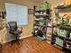 Functional office space with a large window, storage shelves, and laminate wood flooring at 12237 Tavares Ridge Cir # 67, Tavares, FL 32778