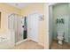 Well-appointed bathroom featuring a glass-enclosed shower, soaking tub, toilet room and neutral color scheme at 12239 Se 92Nd Court Rd, Summerfield, FL 34491