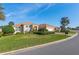 Lovely single-story home with a well-kept lawn, paved driveway, attached two-car garage and mature landscaping at 12239 Se 92Nd Court Rd, Summerfield, FL 34491