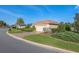 Inviting single-story residence boasting a paved driveway, a two-car garage, and lush greenery at 12239 Se 92Nd Court Rd, Summerfield, FL 34491