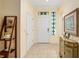 Inviting foyer with tile flooring, bright walls, and a decorative console table at 12239 Se 92Nd Court Rd, Summerfield, FL 34491