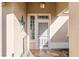 Covered entry featuring a decorative security door, unique stained-glass window, and custom water feature at 12239 Se 92Nd Court Rd, Summerfield, FL 34491