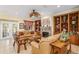 Cozy living room featuring a fireplace and built-in bookshelves at 12239 Se 92Nd Court Rd, Summerfield, FL 34491
